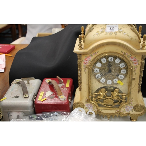 223 - Lacquered mantel clock, and two pigeon timers.