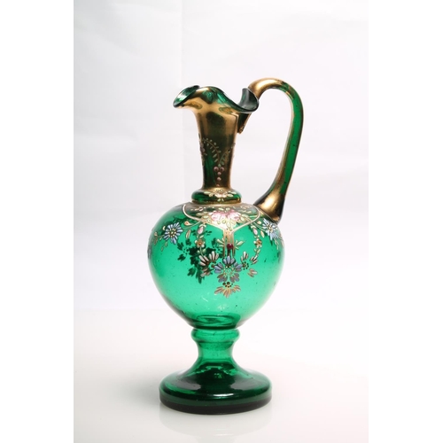 233 - Bohemian green glass ewer in the manner of Moser with hand-painted enamel flower decoration, 20cm hi... 