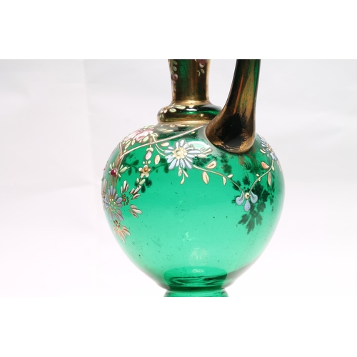 233 - Bohemian green glass ewer in the manner of Moser with hand-painted enamel flower decoration, 20cm hi... 