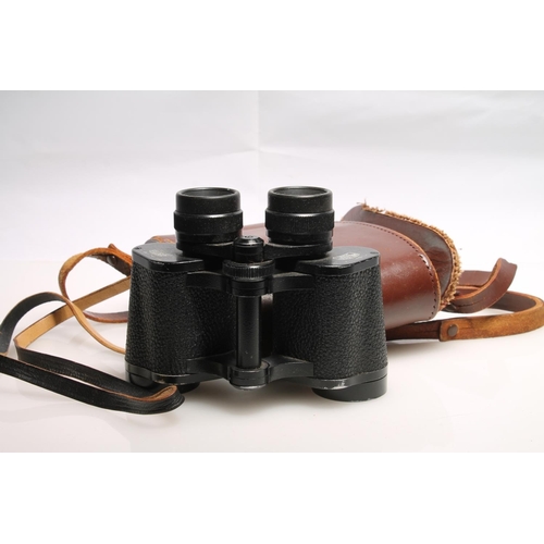 243 - Pair of Carl Zeiss Jenoptem 8x30 binoculars, in brown leather case.