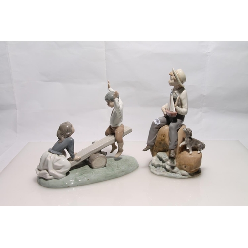 253 - Two Lladro figurines to include a girl and boy on see-saw and girl and boy with sailing boat.  ... 