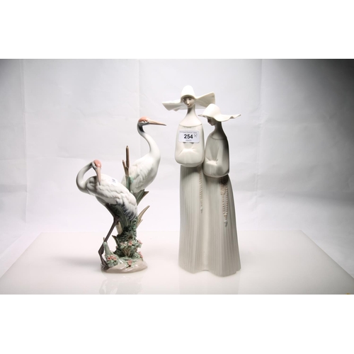 254 - Lladro two nuns figure group and a Lladro model of storks, largest 33cm high.  (2) 