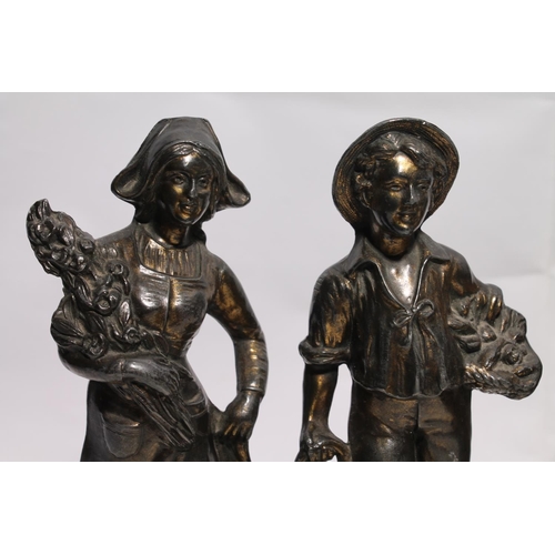 258 - Bronze patinated spelter figure of young gentleman in traditional costume, a pair of figures of a ga... 