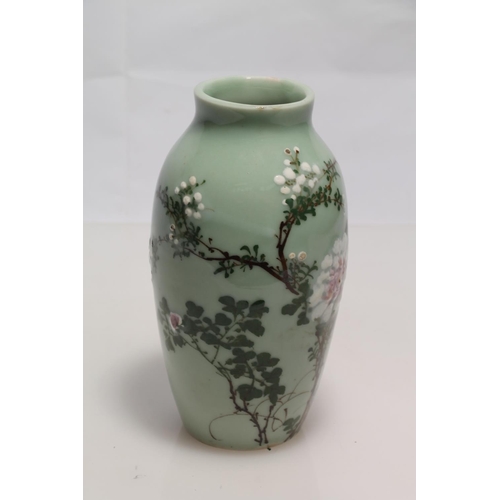 267 - Japanese Keito ware baluster vase decorated with chrysanthemum blossom, 17cm high.