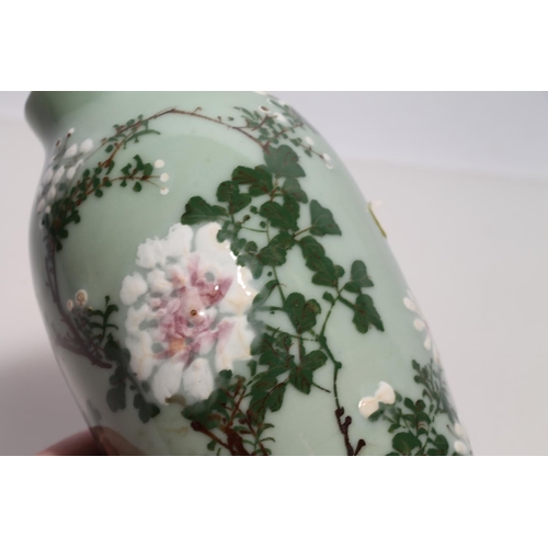 267 - Japanese Keito ware baluster vase decorated with chrysanthemum blossom, 17cm high.