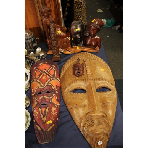 40 - Indonesian carved wood bust of female, a Balinese type figure, a Chinese wall mask, a Canadian totem... 