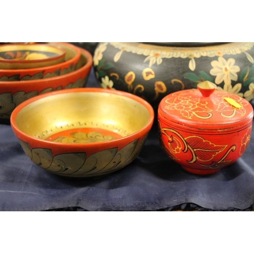 50 - Oriental painted lacquer ware to include bowls, lidded jars, a spoon, etc.