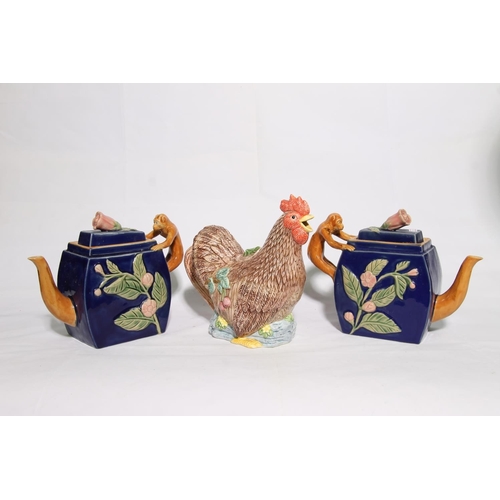 89 - Pair of Maiolica classical design monkey teapots and a novelty chicken teapot.