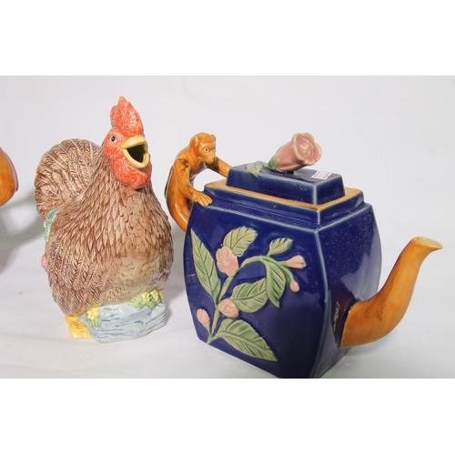 89 - Pair of Maiolica classical design monkey teapots and a novelty chicken teapot.