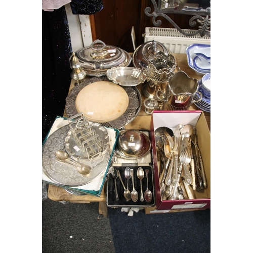 93 - Silver-plated ware to include tureens and covers, a toastrack, a wine slide, bread plates, etc.