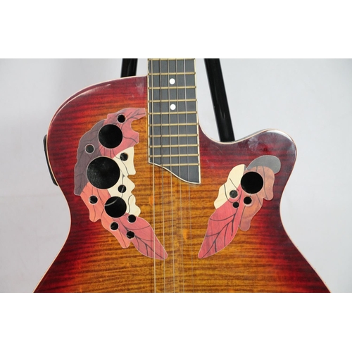 404 - Spider five string electric guitar with sunburst and leaf design.