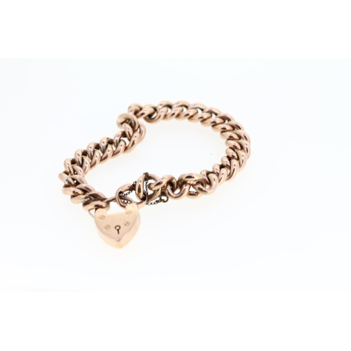 465 - 9ct gold curb link bracelet with heart shaped clasp, 18.3g.