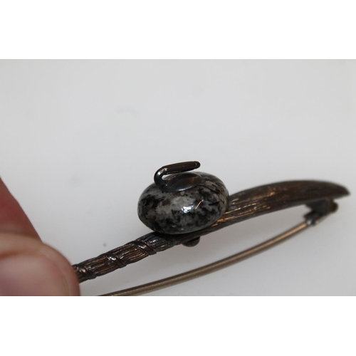 475 - Late Victorian Scottish hallmarked silver brooch in the form of a curling stone and brush, W7cm.