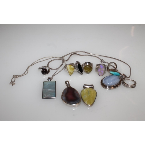 548 - Silver semi-precious stone set modernist rings, pendants etc.