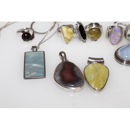 548 - Silver semi-precious stone set modernist rings, pendants etc.