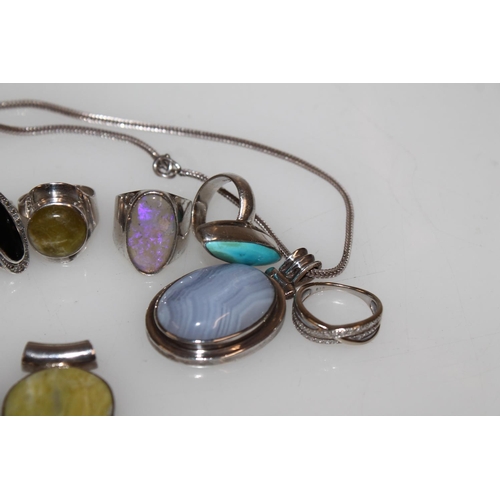 548 - Silver semi-precious stone set modernist rings, pendants etc.