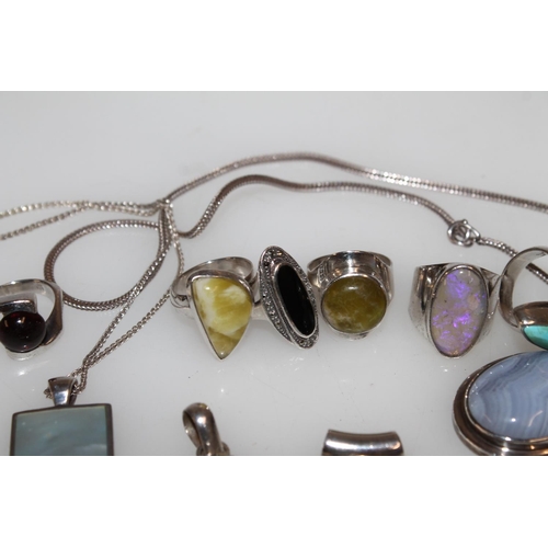 548 - Silver semi-precious stone set modernist rings, pendants etc.