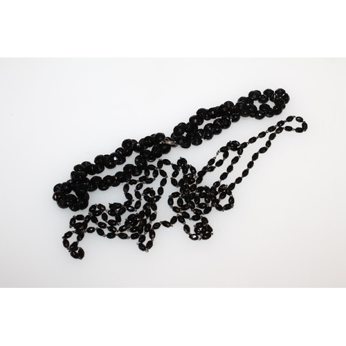 554 - Simulated pearl necklaces together with a French glass black beaded necklace