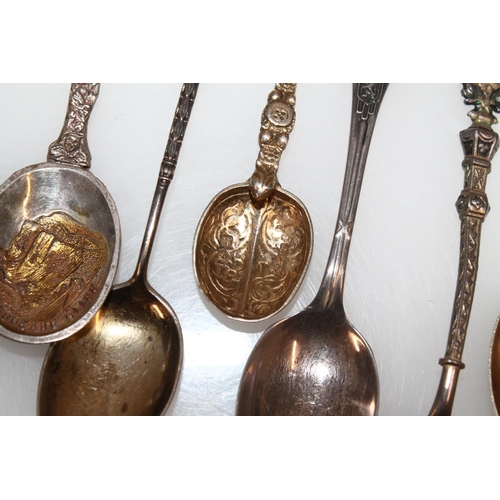 603 - Hallmarked silver souvenir teaspoons, gross 125g.