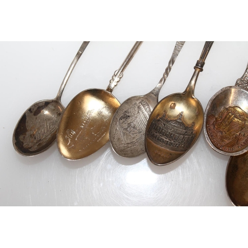 603 - Hallmarked silver souvenir teaspoons, gross 125g.