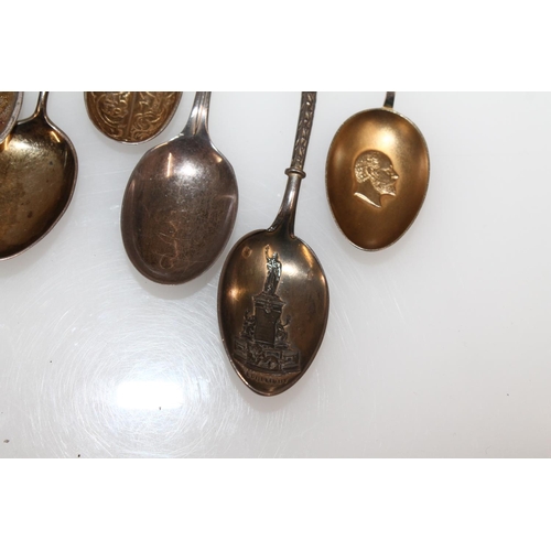 603 - Hallmarked silver souvenir teaspoons, gross 125g.