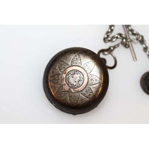 610 - Victorian silver cased open face key wind pocket watch with engraved dial, on white metal albert cha... 