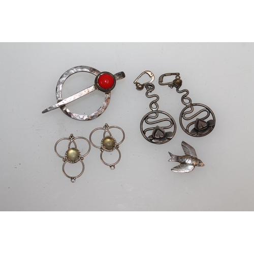 618 - Arts & Crafts style hammered white metal penannular brooch and two pairs of earrings, probably b... 