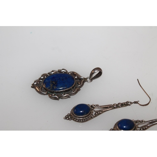 625 - Suite of white metal and lapis lazuli jewellery comprising ring, pendant and pair of earrings.