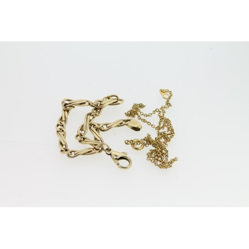 538 - 14ct gold infinity link chain bracelet, 9.2g, together with a fine yellow metal chain necklace.