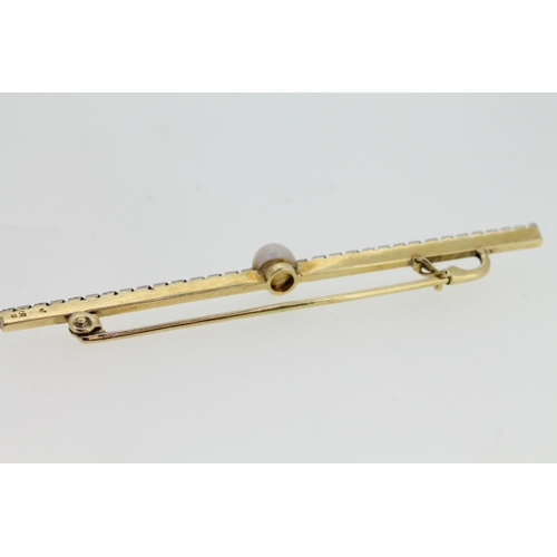 544 - Yellow and white metal bar brooch set with single pearl, tests as 9ct, 2.3g.