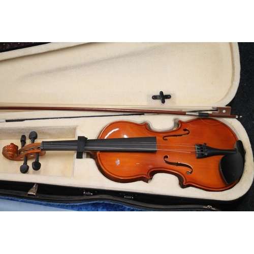 393 - Two cased violins with bows. (2)