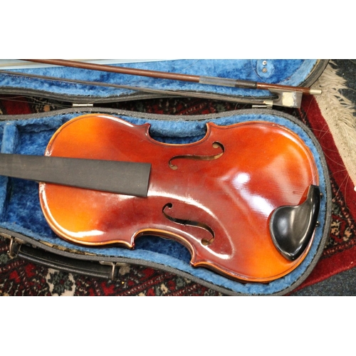 393 - Two cased violins with bows. (2)