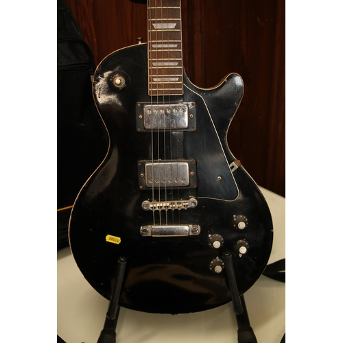 407 - Six string black electric guitar.