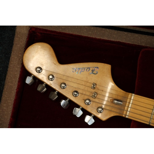 411 - Fodic six string electric guitar in fitted case.