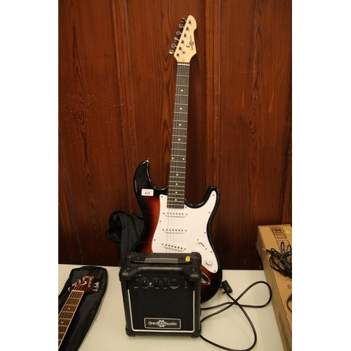 419 - Gear 4 Music six string electric guitar and small amplifier. (2)