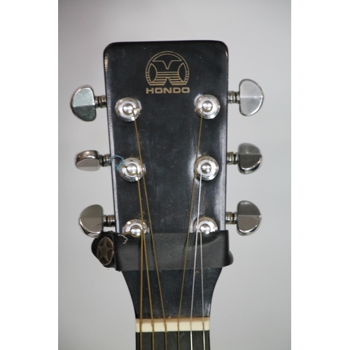 421 - Hondo model H124B-HM six string acoustic guitar.