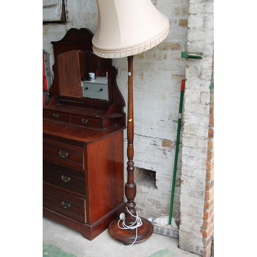 736 - Turned wooden standard lamp, 196cm high.