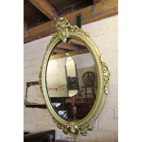 742 - Rococo gilt framed wall mirror, 90cm high.