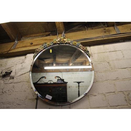 749 - Oval barbola style wall mirror and a round barbola style wall mirror, largest 64cm.