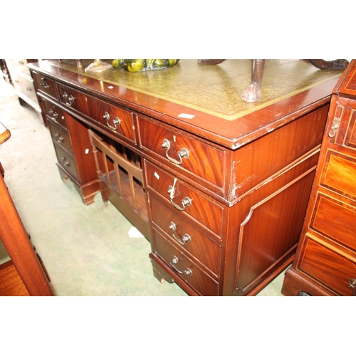 759 - Large Mahogany pedestal desk with green skiver top, W150cm.