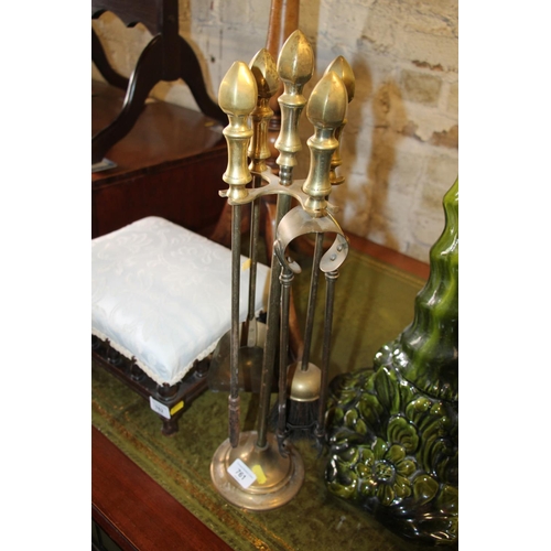 761 - Brass fireside companion set.