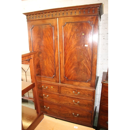 767 - 19th century mahogany wardrobe, over a chest of two short over two long drawers.