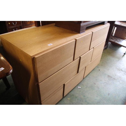 781 - Modern light oak bank of drawers, 77cm high.