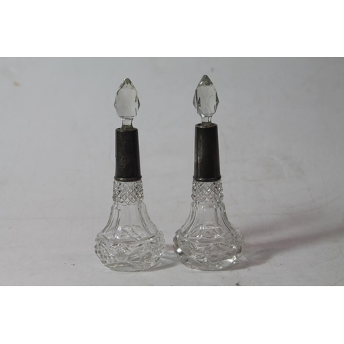 225 - Pair of silver mounted cut-glass scent bottles, 15cm high.