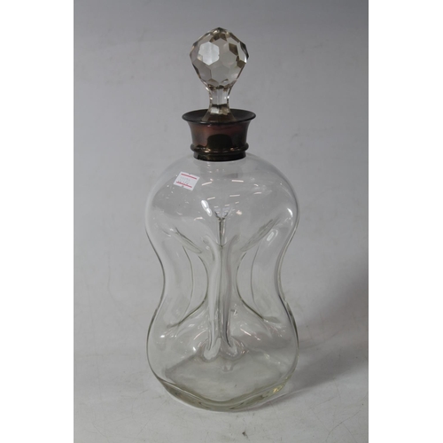 227 - Glass decanter of waisted form with silver collar, 31cm high.