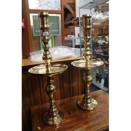 799 - Near pair of brass candle holders, 72cm high.