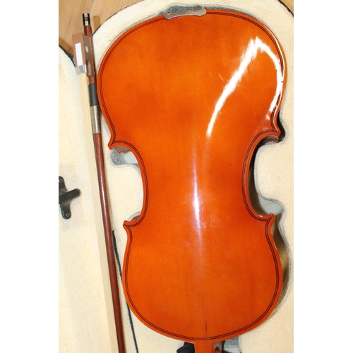 393 - Two cased violins with bows. (2)