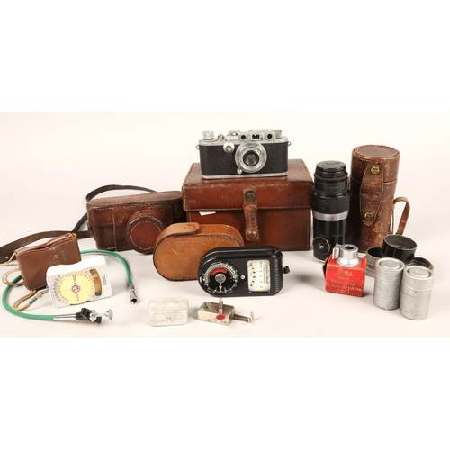 128 - Ernest Leitz Leica D.R.P camera, serial no. 303559, with lens and accessories in leather case