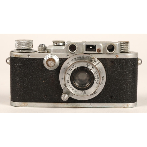 128 - Ernest Leitz Leica D.R.P camera, serial no. 303559, with lens and accessories in leather case