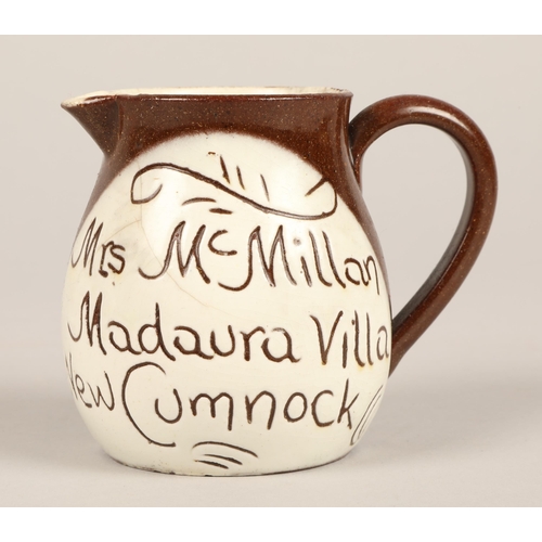 27 - Two Cumnock motto ware teapots, a milk jug and a storage jar (4)